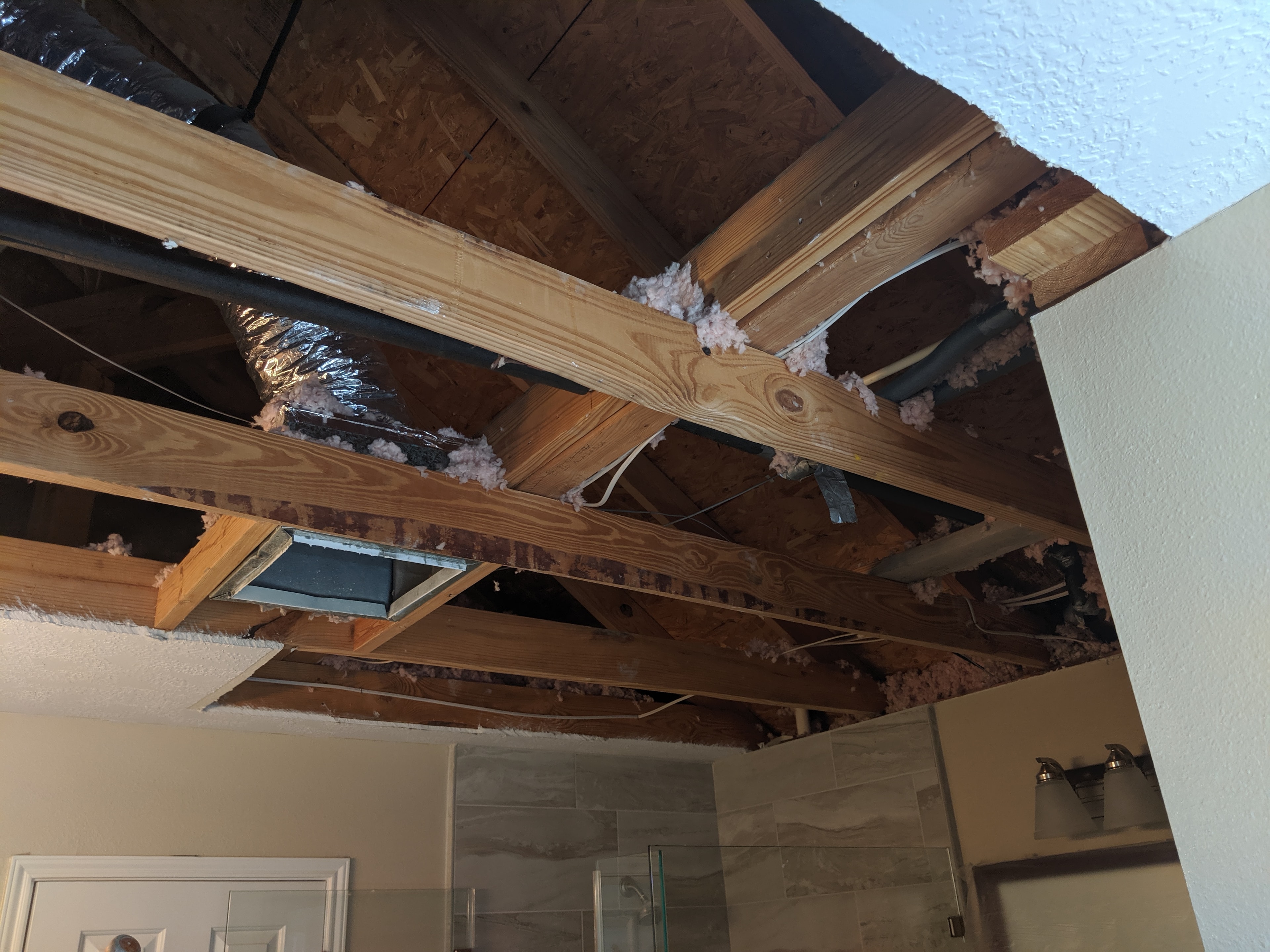 Finished textured ceiling with recessed lighting